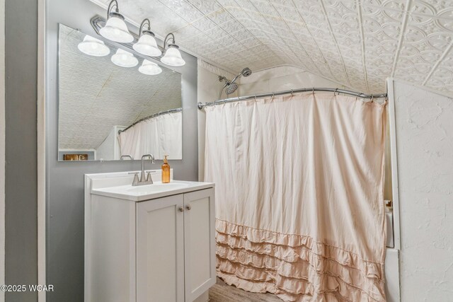 408 Vine St, Kenton, OH 43326 - bathroom featuring an ornate ceiling, vaulted ceiling, vanity, and curtained shower