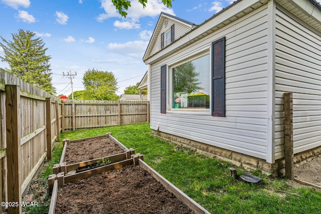408 Vine St, Kenton, OH 43326 - fenced backyard with a vegetable garden