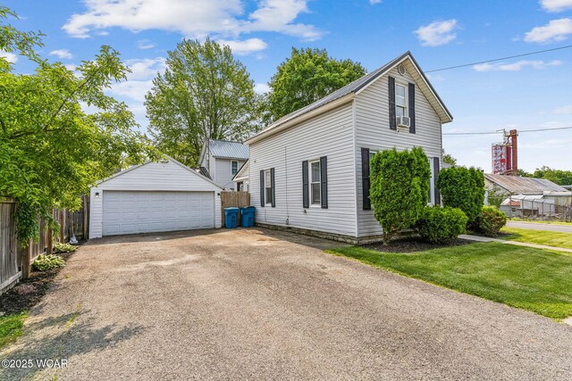 408 Vine St, Kenton, OH 43326 - view of side of home with an outdoor structure and a garage