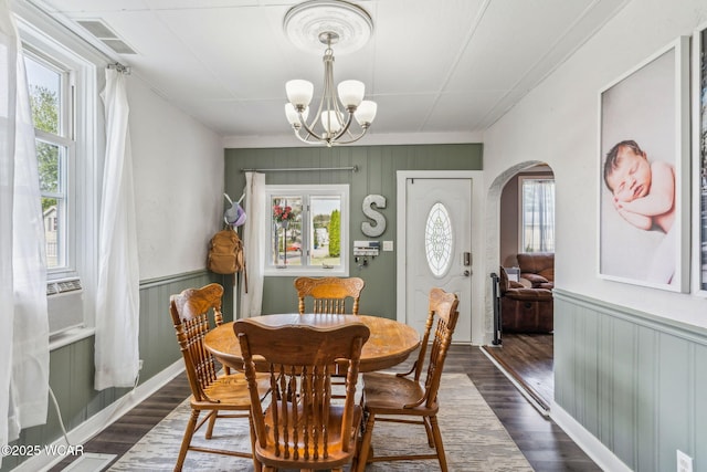 408 Vine St, Kenton, OH 43326 - dining area with arched walkways, plenty of natural light, a chandelier, dark wood finished floors, and crown molding
