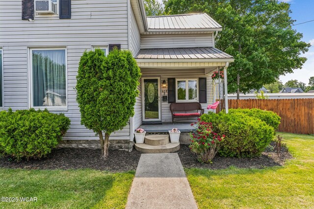 408 Vine St, Kenton, OH 43326 - view of exterior entry featuring a porch and a metal roof