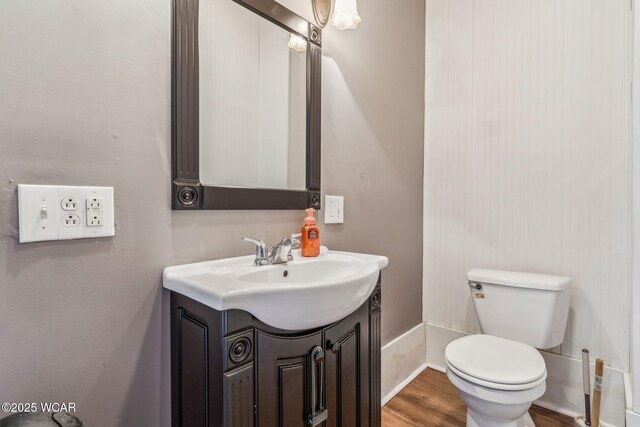 408 Vine St, Kenton, OH 43326 - half bathroom featuring vanity and wood finished floors