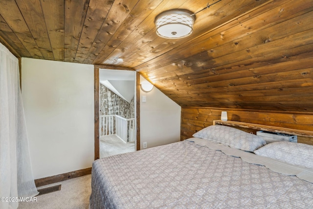408 Vine St, Kenton, OH 43326 - carpeted bedroom featuring wood ceiling, vaulted ceiling, and wooden walls