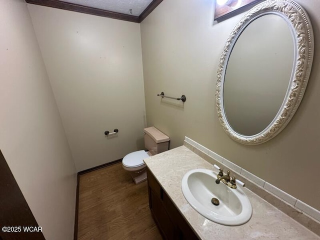 1317 Timberlane Dr, Lima, OH 45805 - half bath with vanity, ornamental molding, wood finished floors, and a textured ceiling