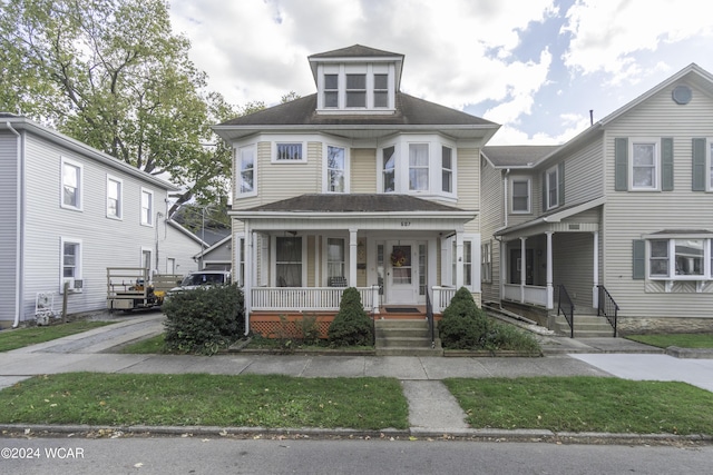 607 W Ash St, Piqua, OH 45356 - view of front of house featuring covered porch and roof with shingles