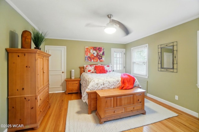 bedroom featuring crown molding, baseboards, and light wood-type flooring