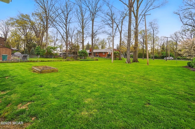 view of yard featuring a garden and fence