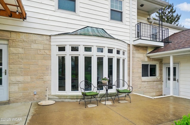view of patio with a balcony
