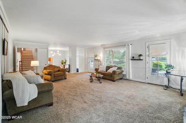 living room featuring carpet floors, baseboards, and stairway
