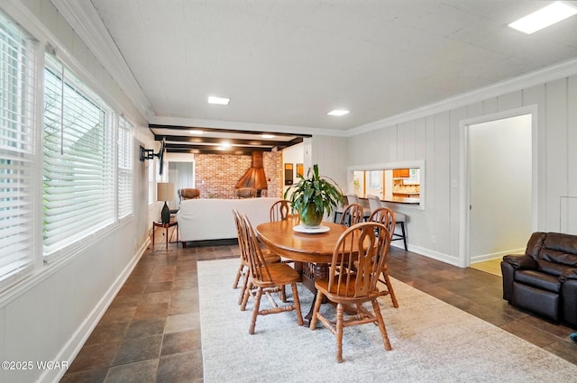 dining room with baseboards and ornamental molding