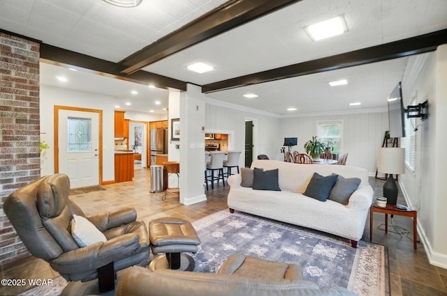 living area featuring baseboards, ornamental molding, recessed lighting, and beam ceiling