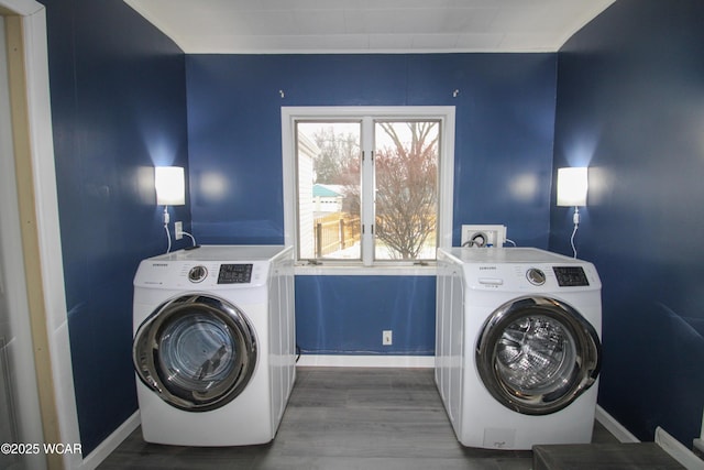 washroom with hardwood / wood-style floors and independent washer and dryer