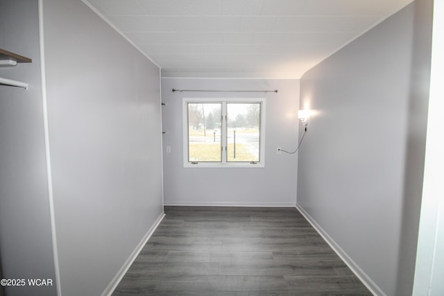 unfurnished room with dark wood-type flooring