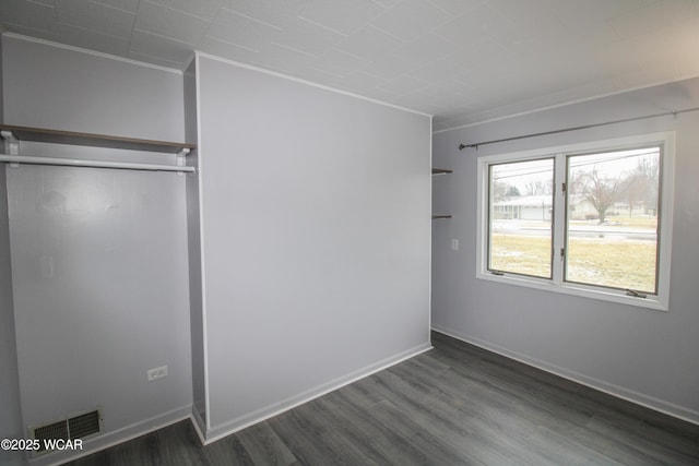 unfurnished room featuring dark hardwood / wood-style flooring