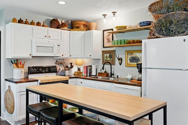 219 N Market St, Kenton, OH 43326 - kitchen featuring white appliances, a sink, wooden counters, white cabinets, and recessed lighting