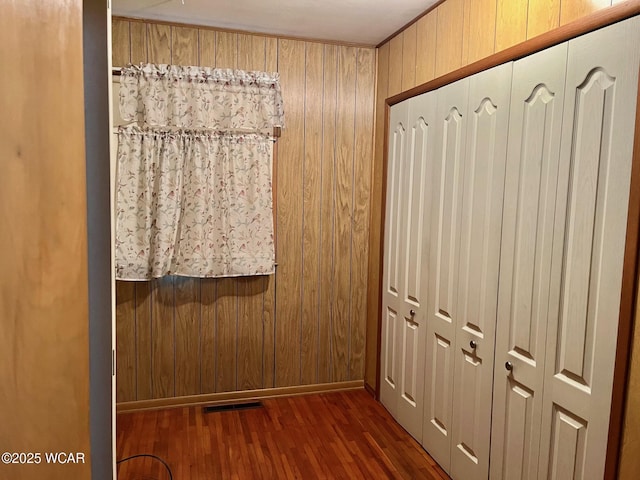 1440 Southwood Dr, Lima, OH 45805 - doorway featuring wood finished floors, wooden walls, and baseboards