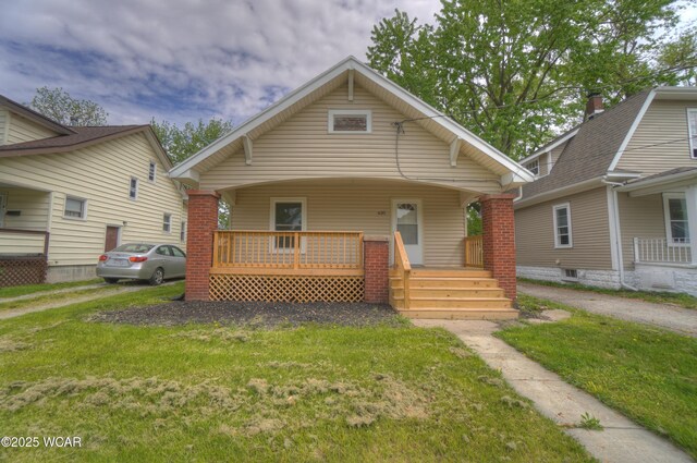 430 Hazel Ave, Lima, OH 45801 - view of front facade with covered porch and a front lawn
