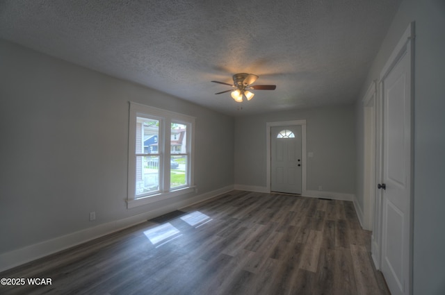 430 Hazel Ave, Lima, OH 45801 - entrance foyer featuring a textured ceiling, wood finished floors, baseboards, and a ceiling fan