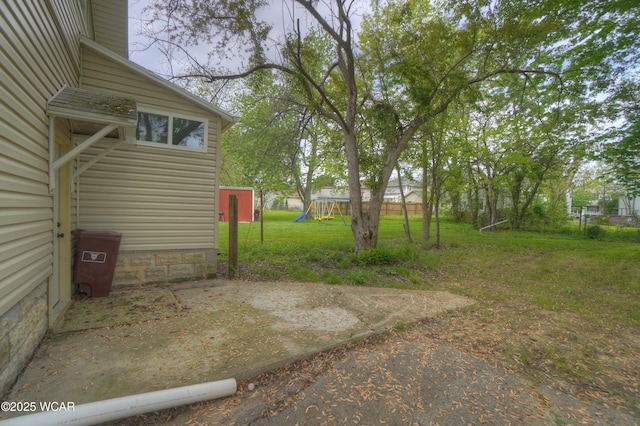 430 Hazel Ave, Lima, OH 45801 - view of green lawn with a playground and a patio area