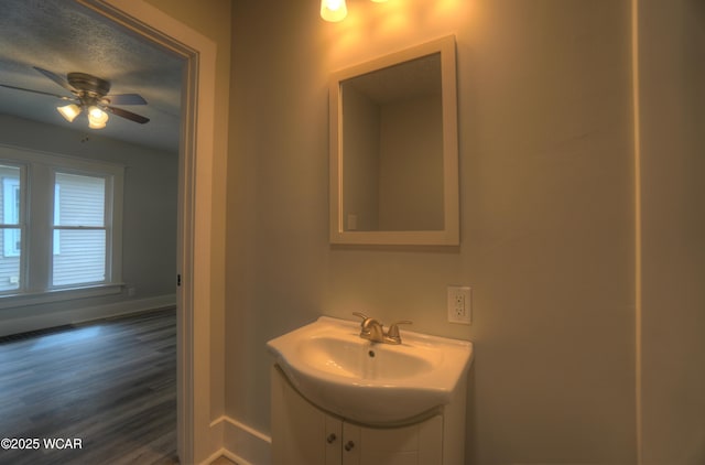 430 Hazel Ave, Lima, OH 45801 - bathroom with baseboards, vanity, wood finished floors, and a ceiling fan