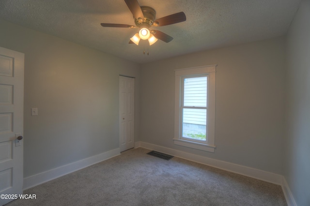 430 Hazel Ave, Lima, OH 45801 - carpeted spare room featuring a textured ceiling, baseboards, and ceiling fan