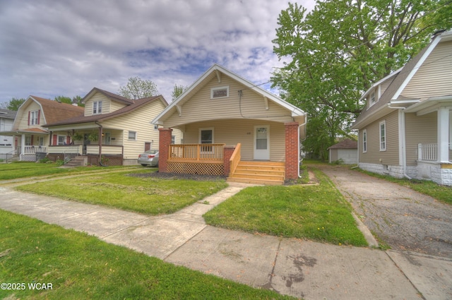 430 Hazel Ave, Lima, OH 45801 - view of front of property featuring a porch, a front lawn, and an outdoor structure