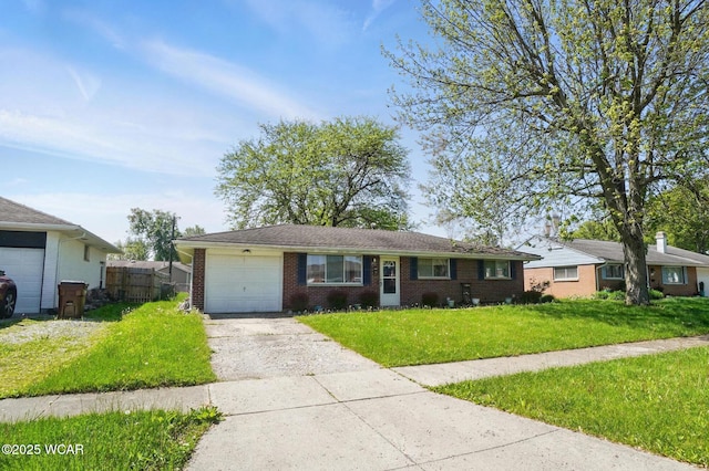 2911 Lakewood Ave, Lima, OH 45805 - ranch-style home with concrete driveway, a garage, and brick siding