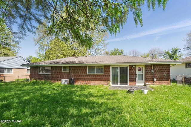 2911 Lakewood Ave, Lima, OH 45805 - rear view of property with brick siding and central air condition unit