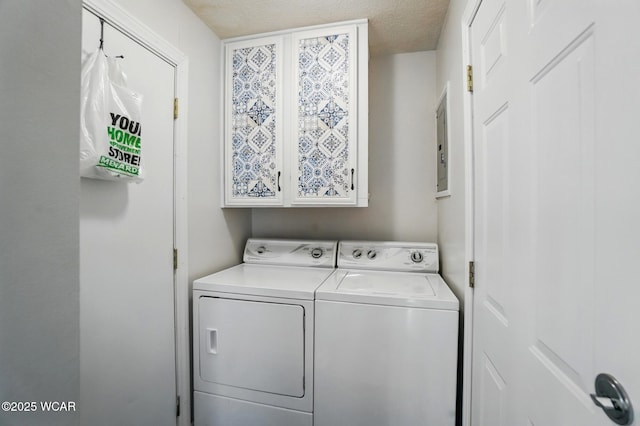 2911 Lakewood Ave, Lima, OH 45805 - washroom featuring washer and dryer, cabinet space, and a textured ceiling