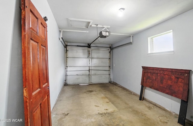 2911 Lakewood Ave, Lima, OH 45805 - garage featuring a garage door opener and baseboards