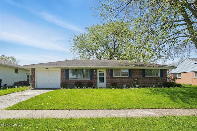 2911 Lakewood Ave, Lima, OH 45805 - ranch-style house with concrete driveway, an attached garage, brick siding, and a front lawn