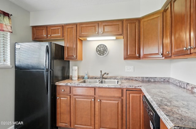 2911 Lakewood Ave, Lima, OH 45805 - kitchen featuring black appliances, a sink, brown cabinetry, and light countertops