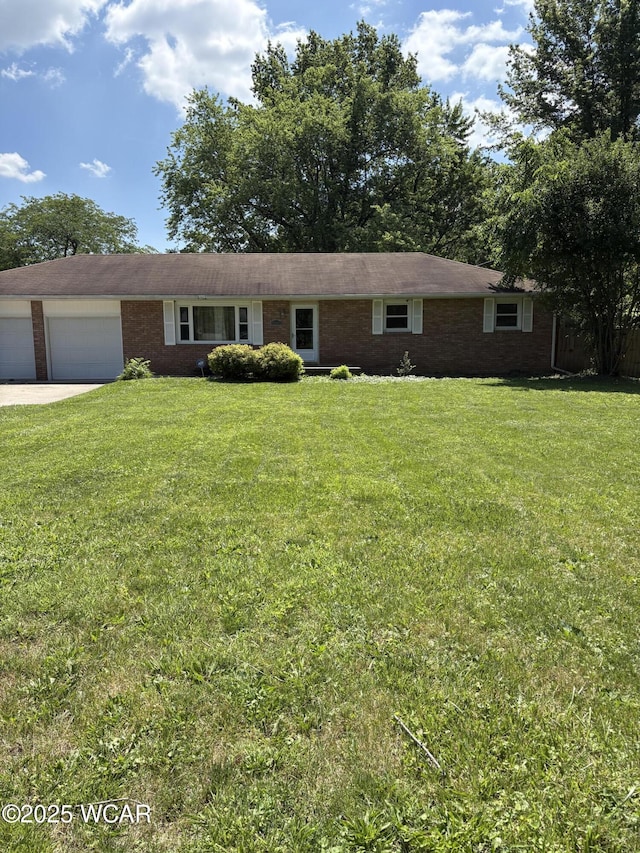 4249 S Dixie Hwy, Lima, OH 45806 - ranch-style house featuring a garage, brick siding, a front yard, and concrete driveway