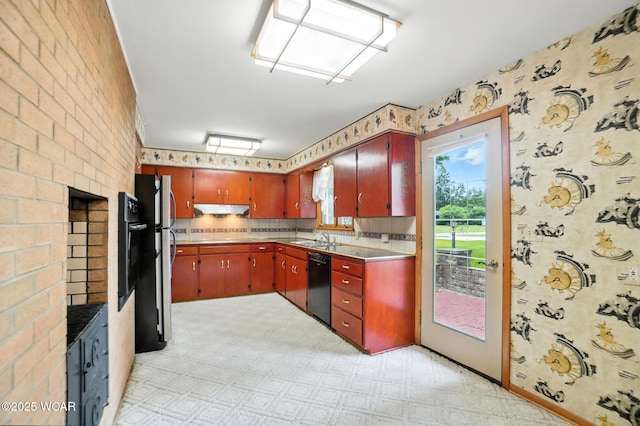 3220 Ft Amanda Rd, Lima, OH 45805 - kitchen with under cabinet range hood, black dishwasher, wallpapered walls, freestanding refrigerator, and light countertops