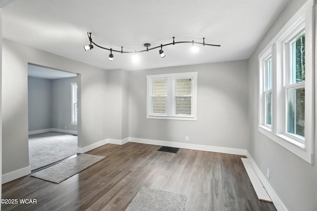 570 W Hazel Ave, Lima, OH 45801 - unfurnished room featuring healthy amount of natural light, wood finished floors, and track lighting
