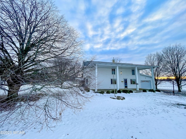 view of front of property with a garage