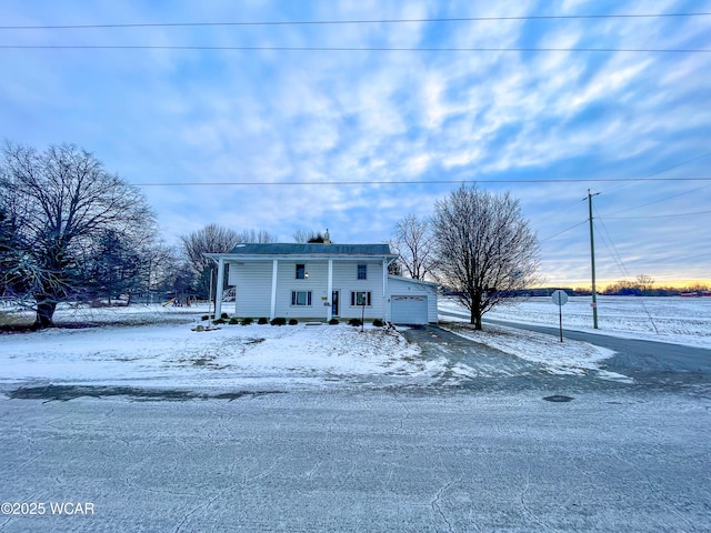 view of front of home featuring a garage and a porch