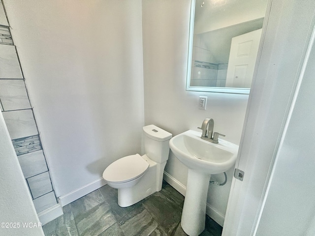 bathroom featuring toilet