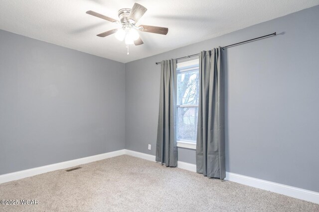 1758 W Hume Rd, Lima, OH 45806 - empty room featuring light carpet, a textured ceiling, and ceiling fan