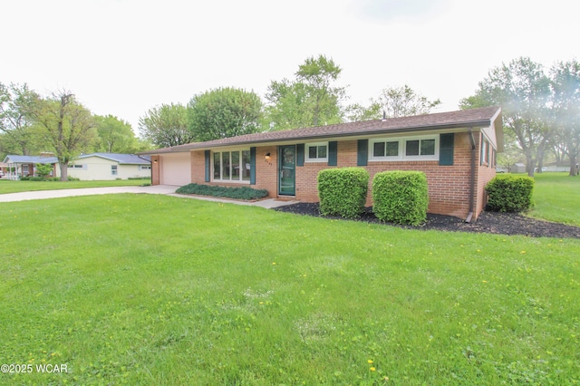 4945 New Haven Dr, Lima, OH 45806 - ranch-style home with an attached garage, concrete driveway, brick siding, and a front lawn