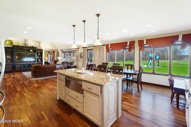 2691 Cremean Rd, Elida, OH 45807 - kitchen with dark wood-style flooring, a warming drawer, pendant lighting, and a kitchen island