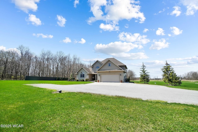 2691 Cremean Rd, Elida, OH 45807 - view of front of property featuring an attached garage, driveway, and a front yard