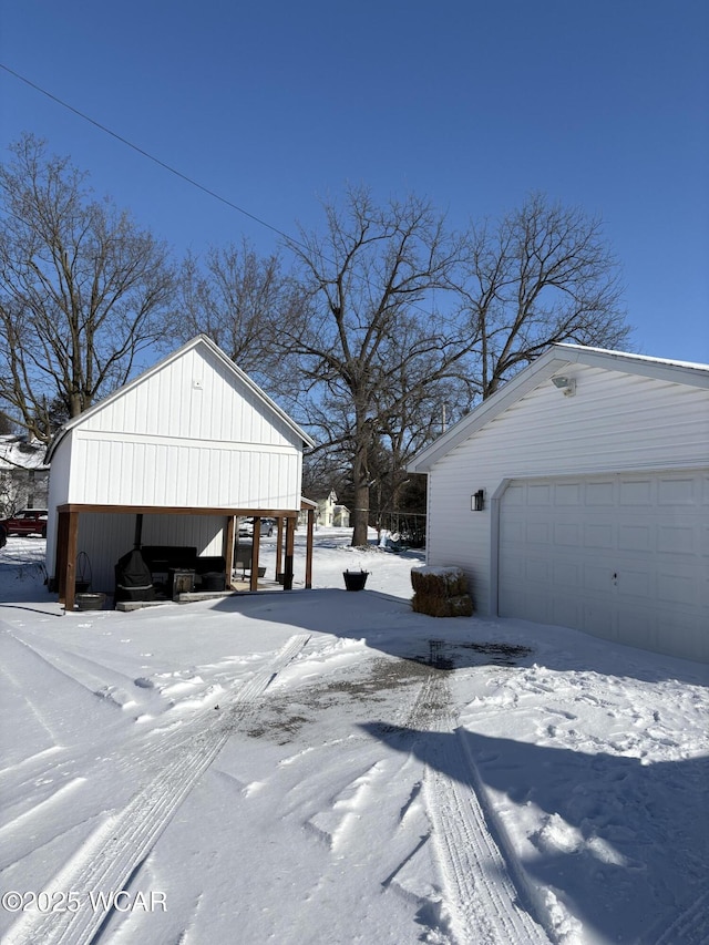 exterior space featuring a garage and an outdoor structure