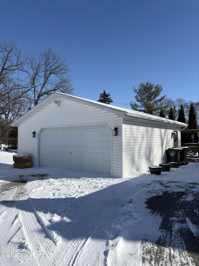 view of snow covered garage