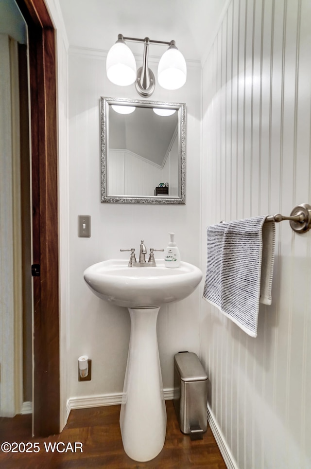 bathroom featuring baseboards and wood finished floors