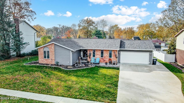 single story home with a garage and a front lawn