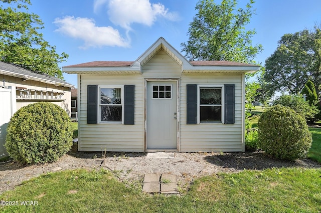 807 Centerfield Dr, Paulding, OH 45879 - view of front facade with an outbuilding and roof with shingles