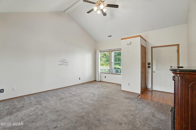 807 Centerfield Dr, Paulding, OH 45879 - unfurnished living room featuring light carpet, a ceiling fan, high vaulted ceiling, and beam ceiling