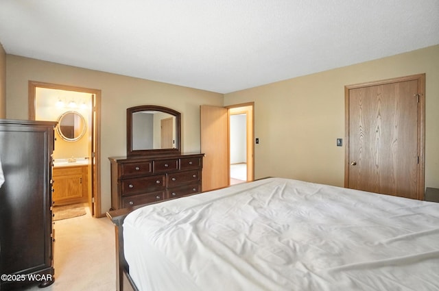 807 Centerfield Dr, Paulding, OH 45879 - bedroom with light colored carpet and ensuite bathroom