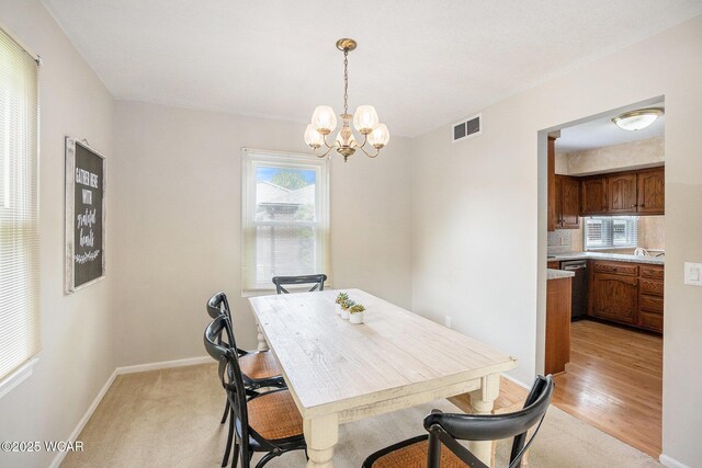 2069 High Ridge Rd, Lima, OH 45805 - dining room featuring a chandelier and baseboards